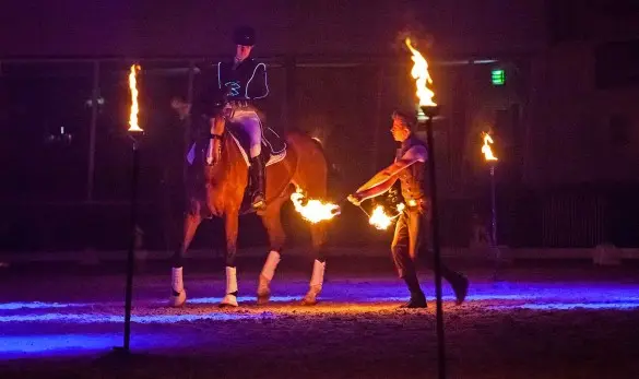 Fin Jopson rides through fire to demonstrate his horse training